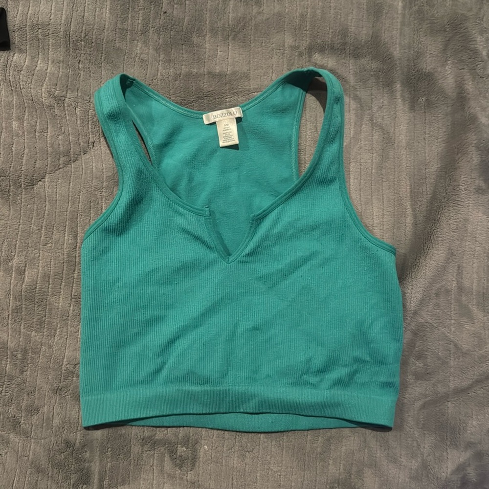 pretty turquoise cropped shirt withh slit down the front